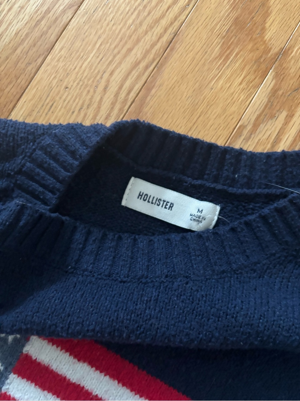 Hollister Men's Dark Blue Crewneck Sweater with Red & White Stripe Detail